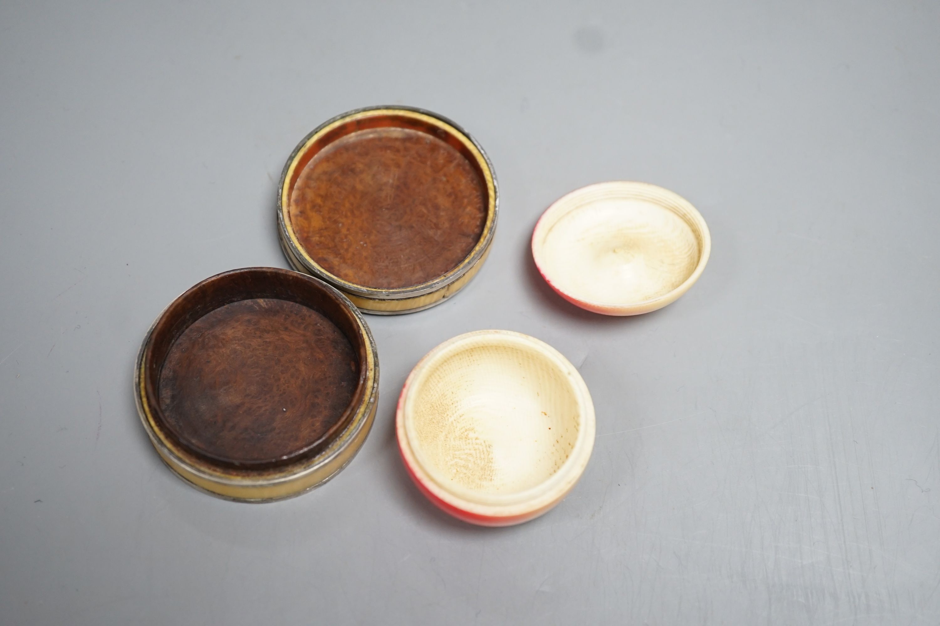 An early 19th century Ivory and blue Jasper mounted box and a 19th century coloured ivory box in the form of an apple (2) largest 5.5cm diameter